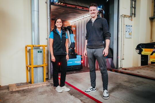 JoJo Windsor, Staff Project Engineer at Boston Dynamics and Tomek Pauer, Program Lead at the Otto Group in front of Stretch